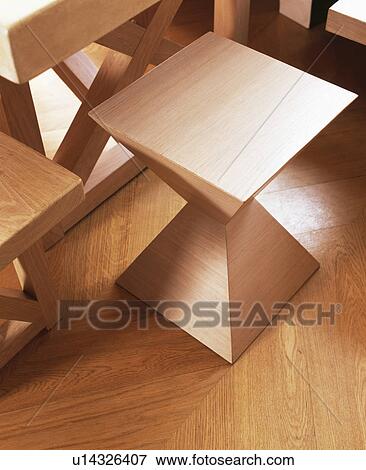 Close-up of modern square-topped wooden stool View Large Photo Image Stock Photo - Close-up of modern square-topped wooden stool. Fotosearch