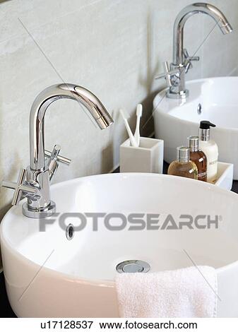 Close-up of modern white bowl-basin and chrome mixer tap View Large Photo Image Stock Photo - Close-up of modern white bowl-basin and chrome mixer tap. Fotosearch