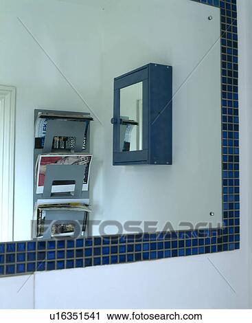 Close-up of mosaic-framed mirror with reflection of shelves View Large Photo Image Stock Image - Close-up of mosaic-framed mirror with reflection of shelves. Fotosearch