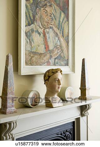 Close-up of oil portrait above obelisks and bust on mantelpiece View Large Photo Image Stock Photo - Close-up of oil portrait above obelisks and bust on mantelpiece. Fotosearch