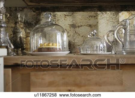 Stock Photo - Close-up of old glass domes on table. Fotosearch