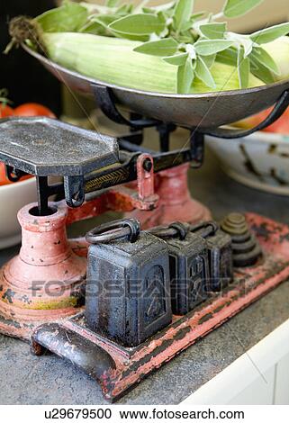 Stock Image - Close-up of old metal scales and weights. Fotosearch