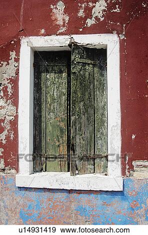 Close up of old wooden shutters on window of Venetian house View Large Photo Image Stock Photo - Close up of old wooden shutters on window of Venetian house . Fotosearch