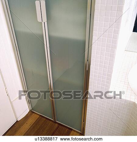Close-up of opaque glass shower doors View Large Photo Image Stock Photo - Close-up of opaque glass shower doors. Fotosearch