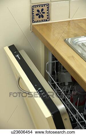 Picture - Close-up of open dishwasher. Fotosearch