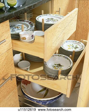 Close-up of open drawers with crockery View Large Photo Image Stock Photo - Close-up of open drawers with crockery. Fotosearch