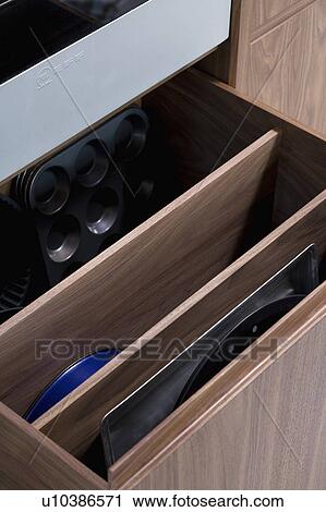 Close-up of open storage drawers in modern kitchen View Large Photo Image Stock Image - Close-up of open storage drawers in modern kitchen. Fotosearch