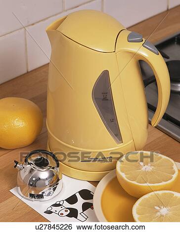 Stock Photograph - Close-up of orange plastic kettle. Fotosearch