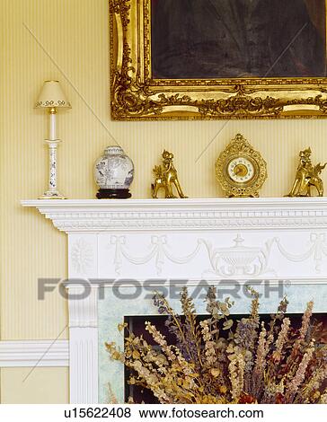 Close Up Of Ornaments On Traditional Fireplace Stock Photo