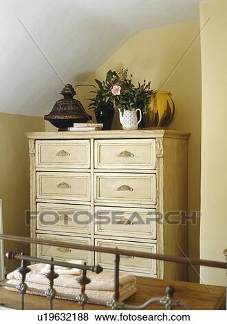 Stock Photo - Close-up of painted cream chest-of-drawers. Fotosearch