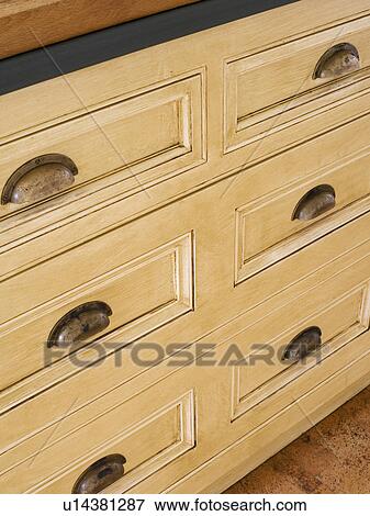 Stock Photo - Close-up of pale wood kitchen storage drawers. Fotosearch