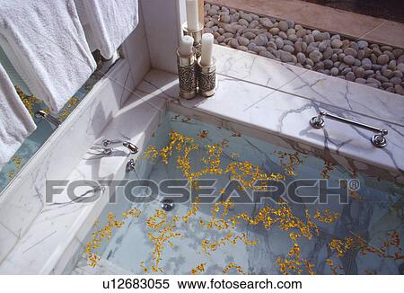 Close-up of petals floating on sunken marble bath View Large Photo Image Stock Photography - Close-up of petals floating on sunken marble bath. Fotosearch