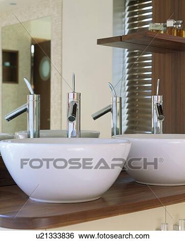 Stock Photograph - Close-up of Philippe Starck basin and tap. Fotosearch