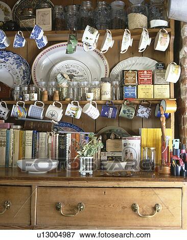 close-up of pine dresser with cups and books and tins of tea View Large Photo Image Stock Photo - close-up of pine dresser with cups and books and tins of tea . Fotosearch