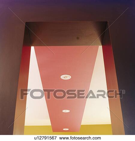 Stock Photo - Close-up of pink and white ceiling in modern hall. Fotosearch