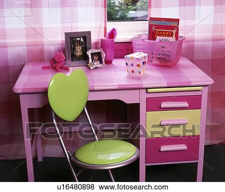 Close-up of pink desk with green chair in child's bedroom View Large Photo Image Stock Photo - Close-up of pink desk with green chair in child's bedroom. Fotosearch