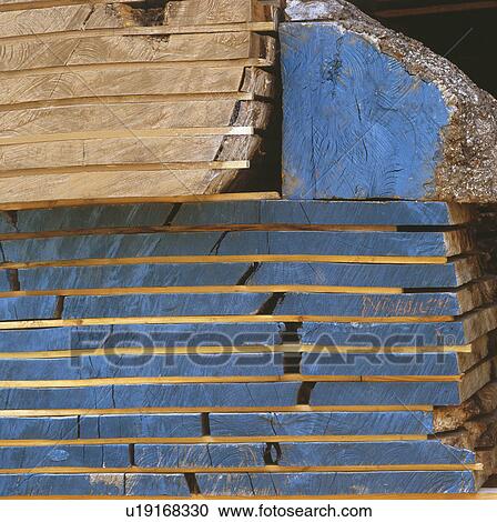 Stock Image - Close-up of planks of timber painted blue. Fotosearch