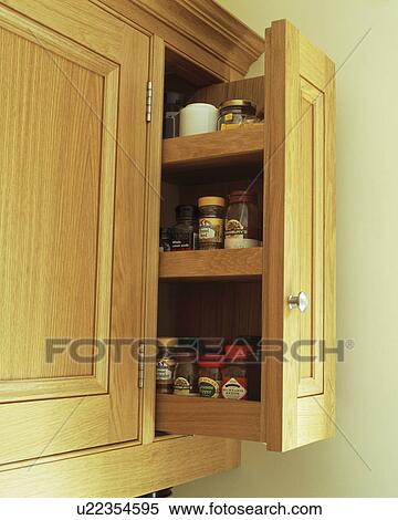 Close Up Of Pull Out Shelves In Kitchen Cupboard Stock Photography