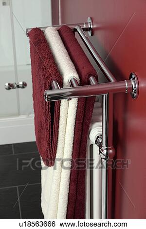 Close-up of red and cream towels on stainless steel heated towel rail View Large Photo Image Stock Photograph - Close-up of red and cream towels on stainless steel heated towel rail. Fotosearch
