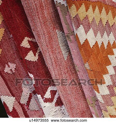 Stock Photography - Close-up of red patterned Kelim carpets. Fotosearch