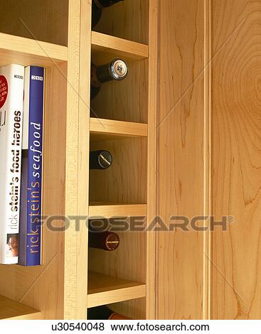 Close-up of shelves storing wine bottles View Large Photo Image Stock Photo - Close-up of shelves storing wine bottles. Fotosearch