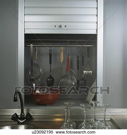 Close-up of sieve and utensils in cupboard with tambour shutter View Large Photo Image Stock Photography - Close-up of sieve and utensils in cupboard with tambour shutter. Fotosearch