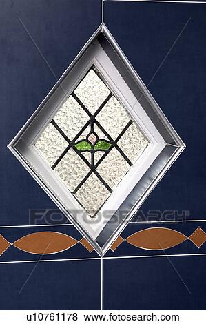 Stock Photo - Close-up of small diamond-shaped stained glass window. Fotosearch