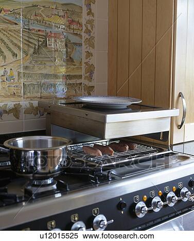 Close-up of small grill on hob View Large Photo Image Stock Photography - Close-up of small grill on hob. Fotosearch