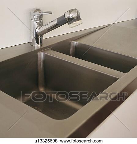 Close-up of stainless steel double sink and tap View Large Photo Image Stock Photo - Close-up of stainless steel double sink and tap. Fotosearch