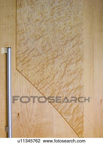 Close-up of stainless steel handle on pale wood door View Large Photo Image Stock Image - Close-up of stainless steel handle on pale wood door. Fotosearch