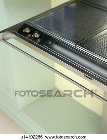 Stock Photograph - Close-up of stainless steel hob. Fotosearch