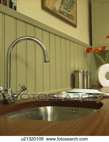 Close-up of stainless steel mixer tap and underset steel sink View Large Photo Image Stock Photo - Close-up of stainless steel mixer tap and underset steel sink. Fotosearch