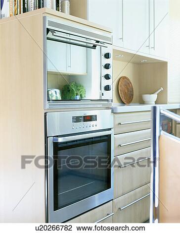 Stock Image - Close-up of stainless steel oven. Fotosearch