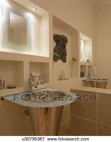 Stock Photo - Close-up of stainless steel pedestal basin in modern white bathroom. Fotosearch