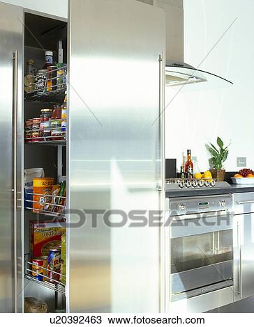 Stock Image - Close-up of stainless steel pull-out storage shelves. Fotosearch