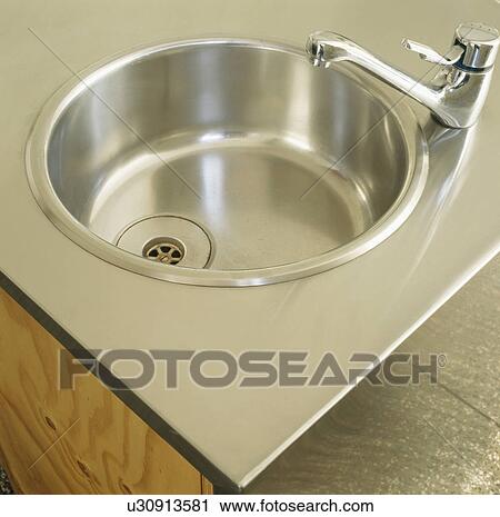 Close-up of stainless steel sink and tap View Large Photo Image Stock Image - Close-up of stainless steel sink and tap. Fotosearch