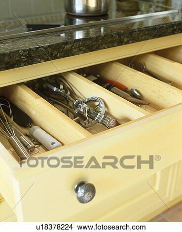 Picture - Close-up of stainless steel utensils in kitchen drawer. Fotosearch