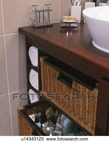 Close-up of storage basket on vanity unit View Large Photo Image Stock Image - Close-up of storage basket on vanity unit. Fotosearch