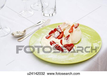 Close-up of strawberries and cream on lime green plate View Large Photo Image Stock Image - Close-up of strawberries and cream on lime green plate. Fotosearch
