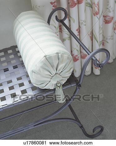 Close up of striped bolster cushion on metal bench  View Large Photo Image Stock Image - Close up of striped bolster cushion on metal bench . Fotosearch