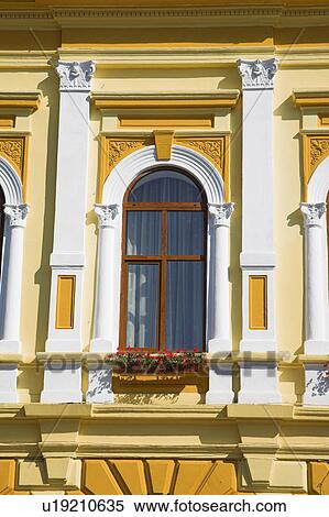 Close up of tall arched window in yellow traditional Romanian townhouse View Large Photo Image Stock Photography - Close up of tall arched window in yellow traditional Romanian townhouse. Fotosearch