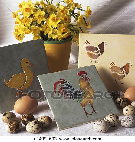 Close-up of tiles stencilled with chickens beside fresh eggs and pot of yellow daffodils View Large Photo Image Stock Image - Close-up of tiles stencilled with chickens beside fresh eggs and pot of yellow daffodils. Fotosearch