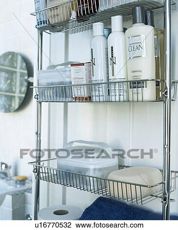 Close-up of toiletries on stainless steel bathroom shelving View Large Photo Image Stock Image - Close-up of toiletries on stainless steel bathroom shelving. Fotosearch