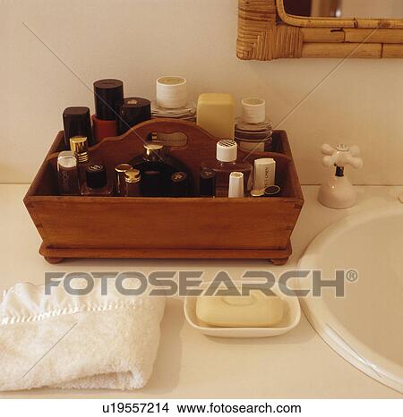 Picture - Close-up of toiletry bottles in wooden box. Fotosearch