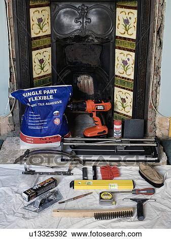Close-up of tools and materials in front of renovated Victorian fireplace View Large Photo Image Stock Image - Close-up of tools and materials in front of renovated Victorian fireplace. Fotosearch
