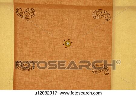 Close-up of traditional orange and yellow Rajastani fabric View Large Photo Image Stock Photo - Close-up of traditional orange and yellow Rajastani fabric. Fotosearch