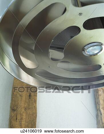 Stock Photo - Close-up of upward view of cylindrical steel extractor. Fotosearch