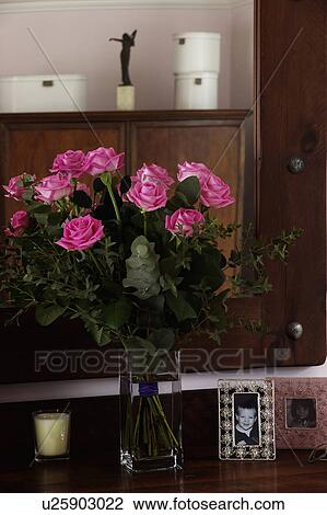 Close-up of vase of pink roses View Large Photo Image Stock Image - Close-up of vase of pink roses . Fotosearch