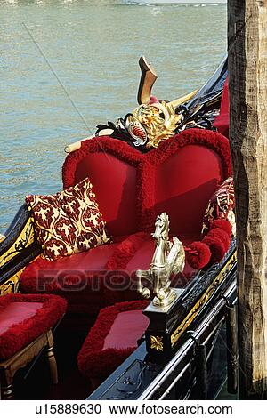 Close up of Venetian gondola with red cushions and and gold details View Large Photo Image Stock Image - Close up of Venetian gondola with red cushions and and gold details . Fotosearch