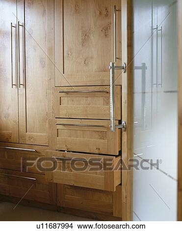 Picture - Close-up of walnut kitchen storage cupboard. Fotosearch
